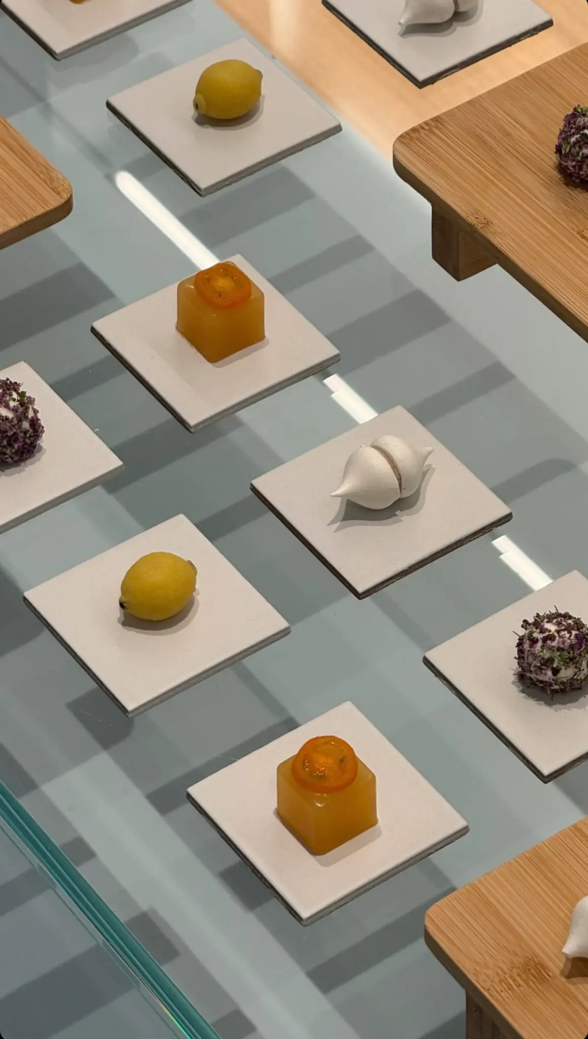 Artistically presented bites on individual stands — event details