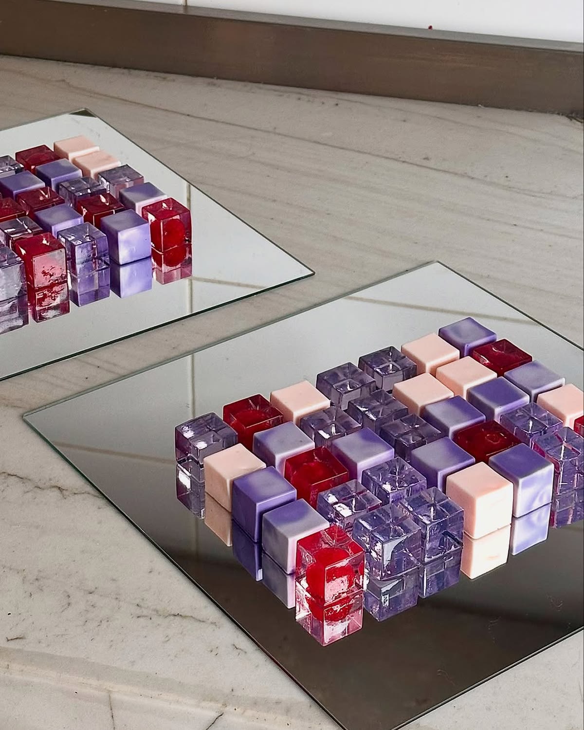Colourful jelly cubes on a mirror — visual detail at an event